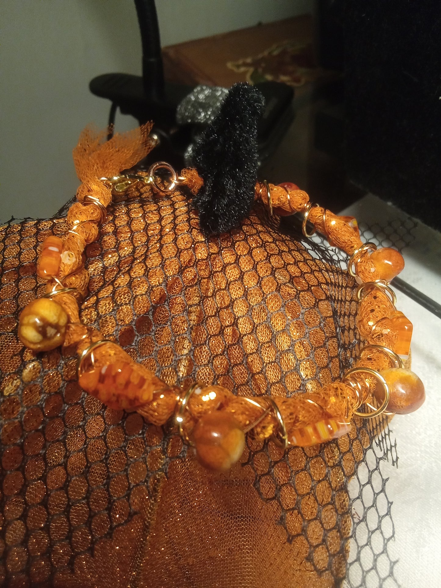 Diamond shaped orange beaded fabric mesh wire bracelet