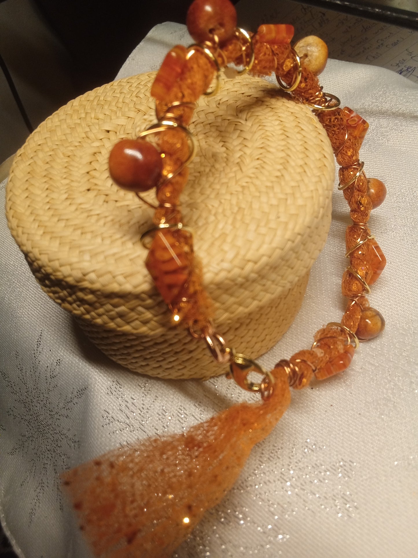 Diamond shaped orange beaded fabric mesh wire bracelet