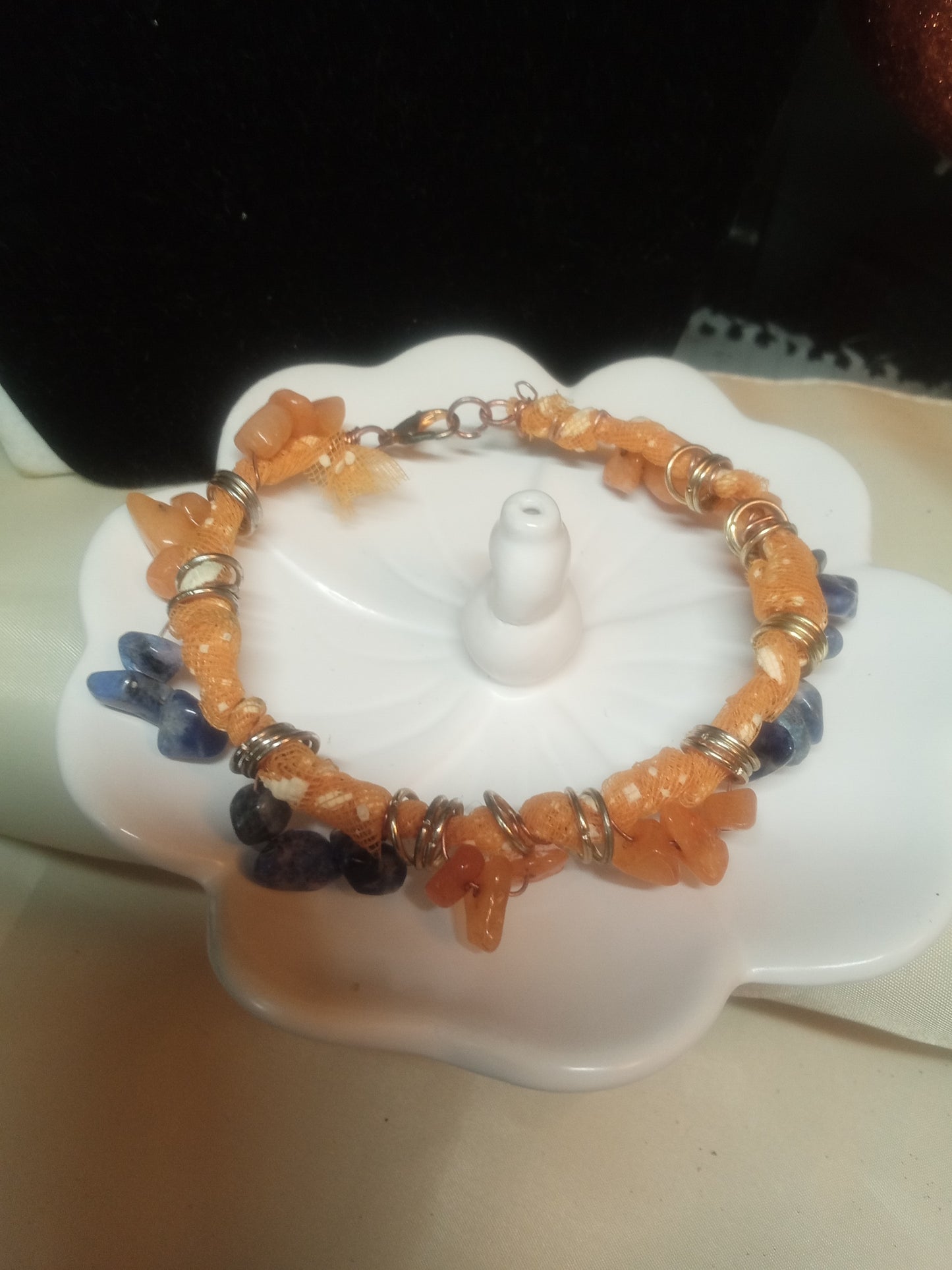 Wire mesh bracelet with orange and blue gemstone chips