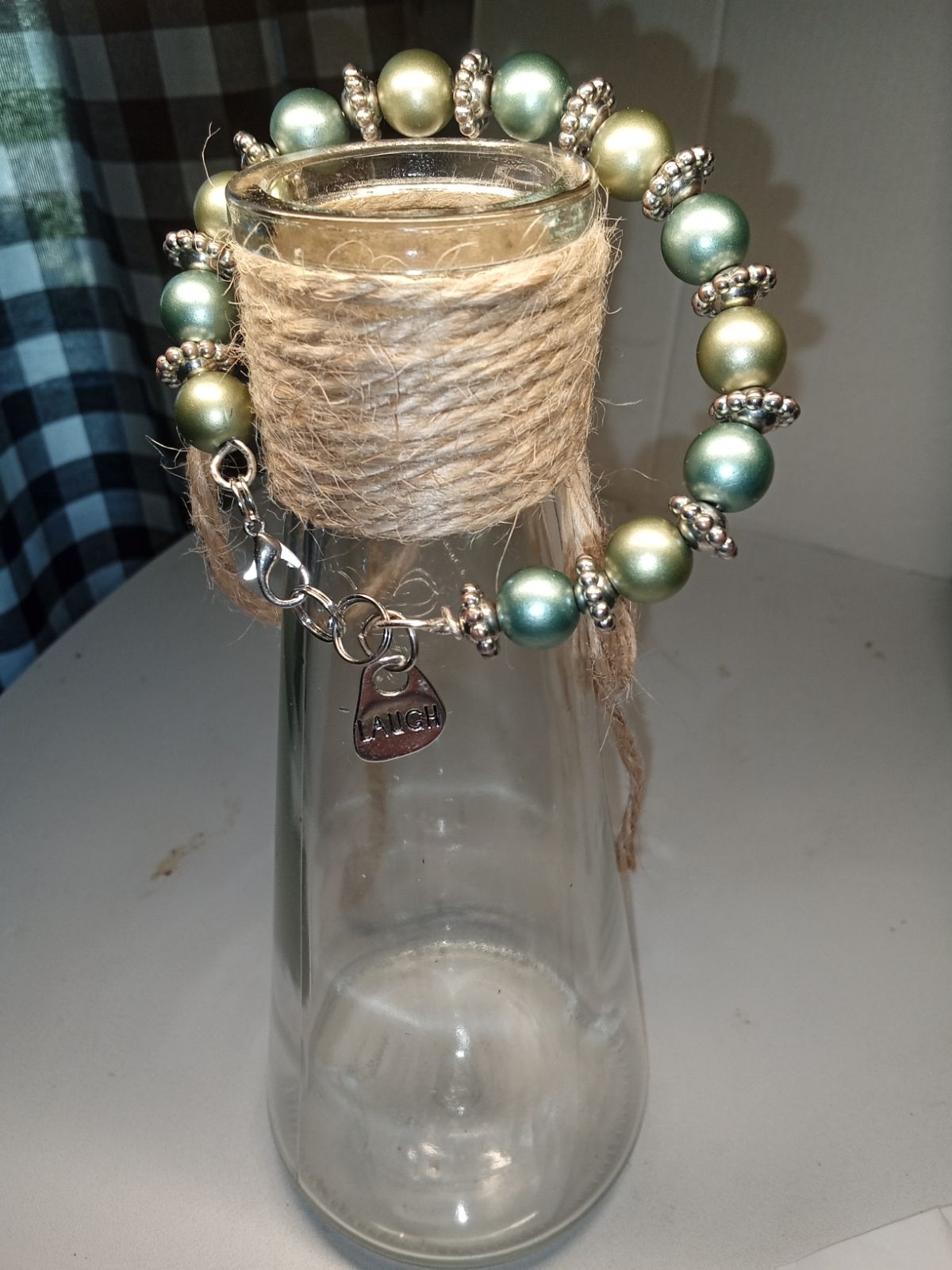 Silver color wire bracelet with two tones of 8mm beads.