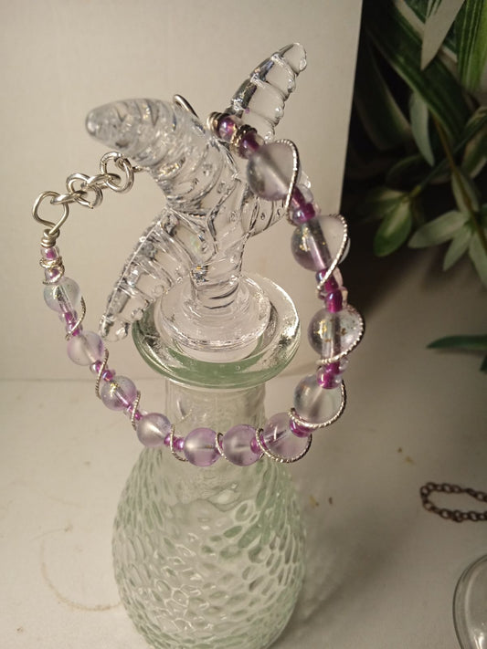 Wire Bracelet with soft clear pink haze beads, bright pink seed beads all wrapped with fancy silver tone twisted wire.